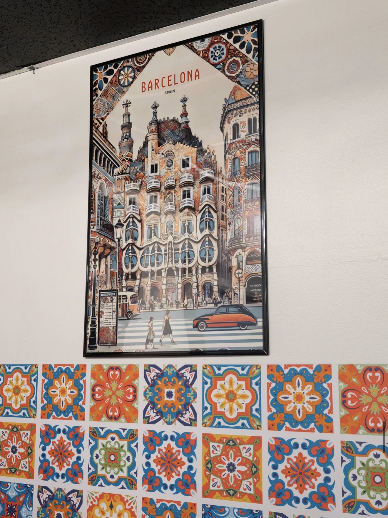 Barcelona travel poster and decorative tiles at Bar-Celona